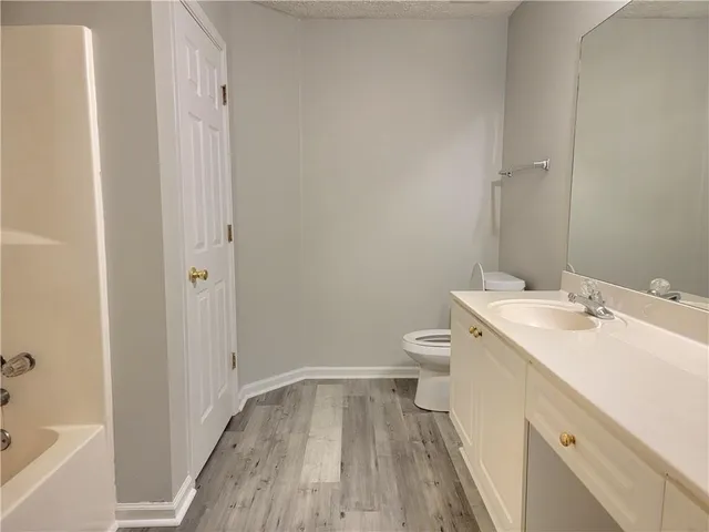 a bathroom with a sink and toilet