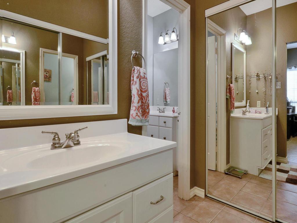3001 Cedar Street, Unit 117 Austin, TX 78705 - Photo 11 of 20 a bathroom with a sink and a mirror