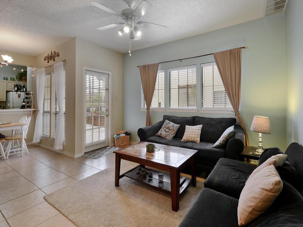 3001 Cedar Street, Unit 117 Austin, TX 78705 - Photo 4 of 20 a living room with furniture and a large window