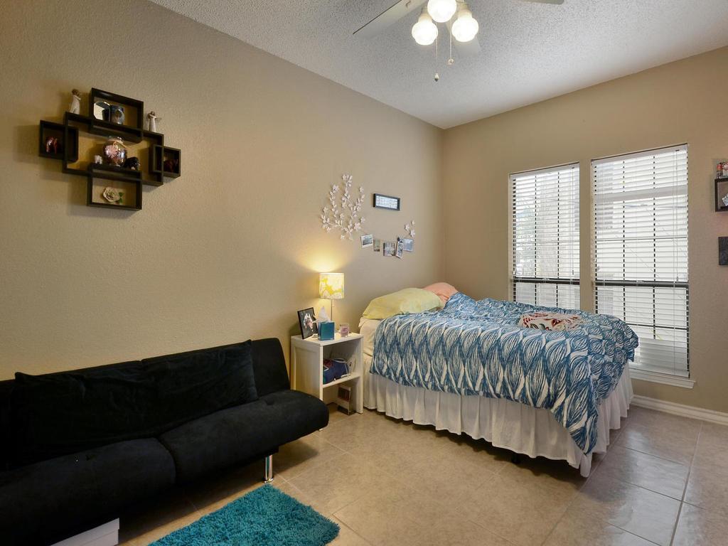 3001 Cedar Street, Unit 117 Austin, TX 78705 - Photo 8 of 20 a spacious bedroom with a bed and window