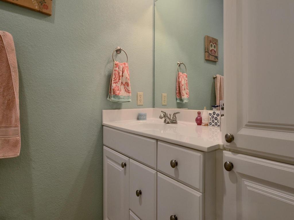 3001 Cedar Street, Unit 117 Austin, TX 78705 - Photo 9 of 20 a bathroom with a sink and a mirror