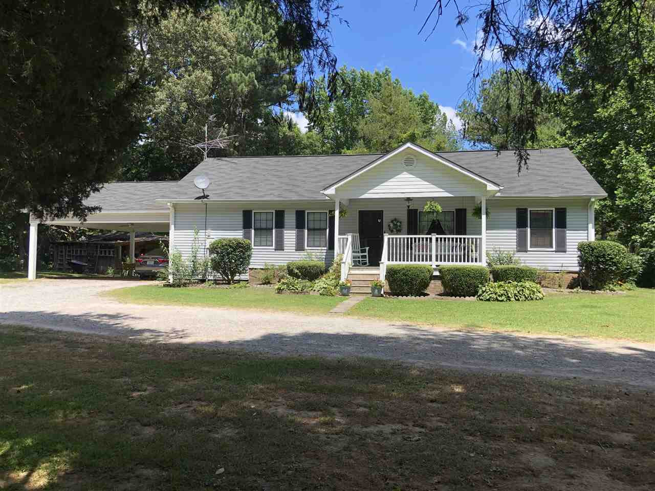 2825 Old Jackson Road Bells, TN 38006 - Photo 1 of 21 a front view of a house with a garden