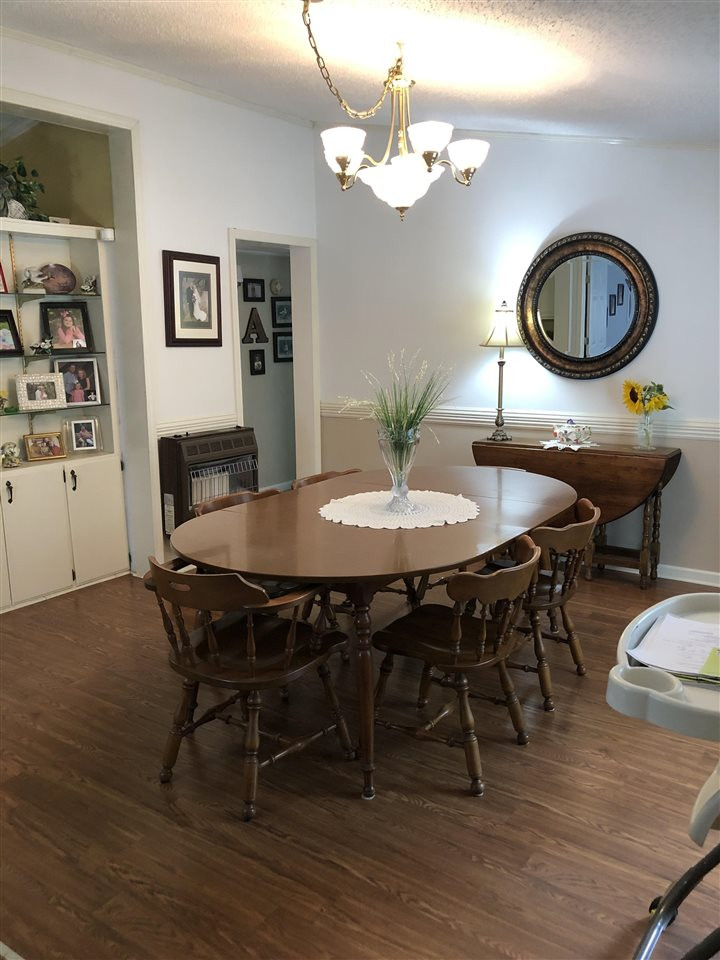 2825 Old Jackson Road Bells, TN 38006 - Photo 7 of 21 a view of a dining room with furniture and wooden floor