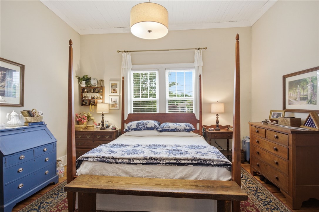 314 South Fairplay Street Seneca, SC 29678 - Photo 20 of 50 This spacious bedroom offers comfortable living with elegant hardwood flooring and a classic window design.