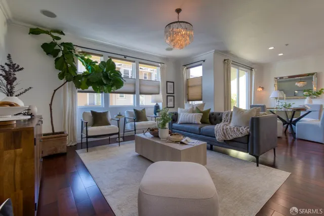 a kitchen with granite countertop a refrigerator and wooden cabinets