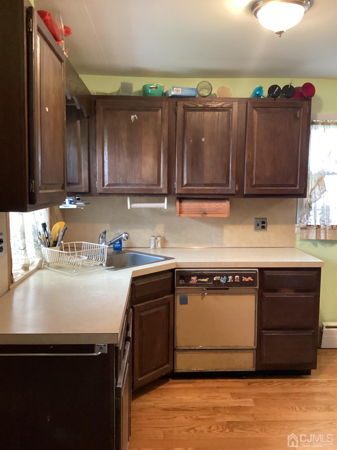 39 Silver Lake Avenue Edison, NJ 08817 - Photo 5 of 20 a kitchen with a sink cabinets and wooden floor