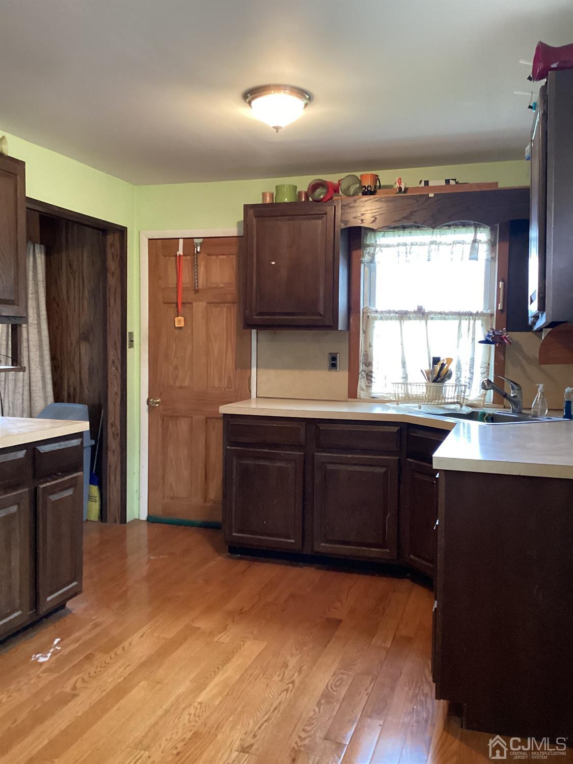 39 Silver Lake Avenue Edison, NJ 08817 - Photo 7 of 20 a kitchen with granite countertop a sink cabinets and stainless steel appliances