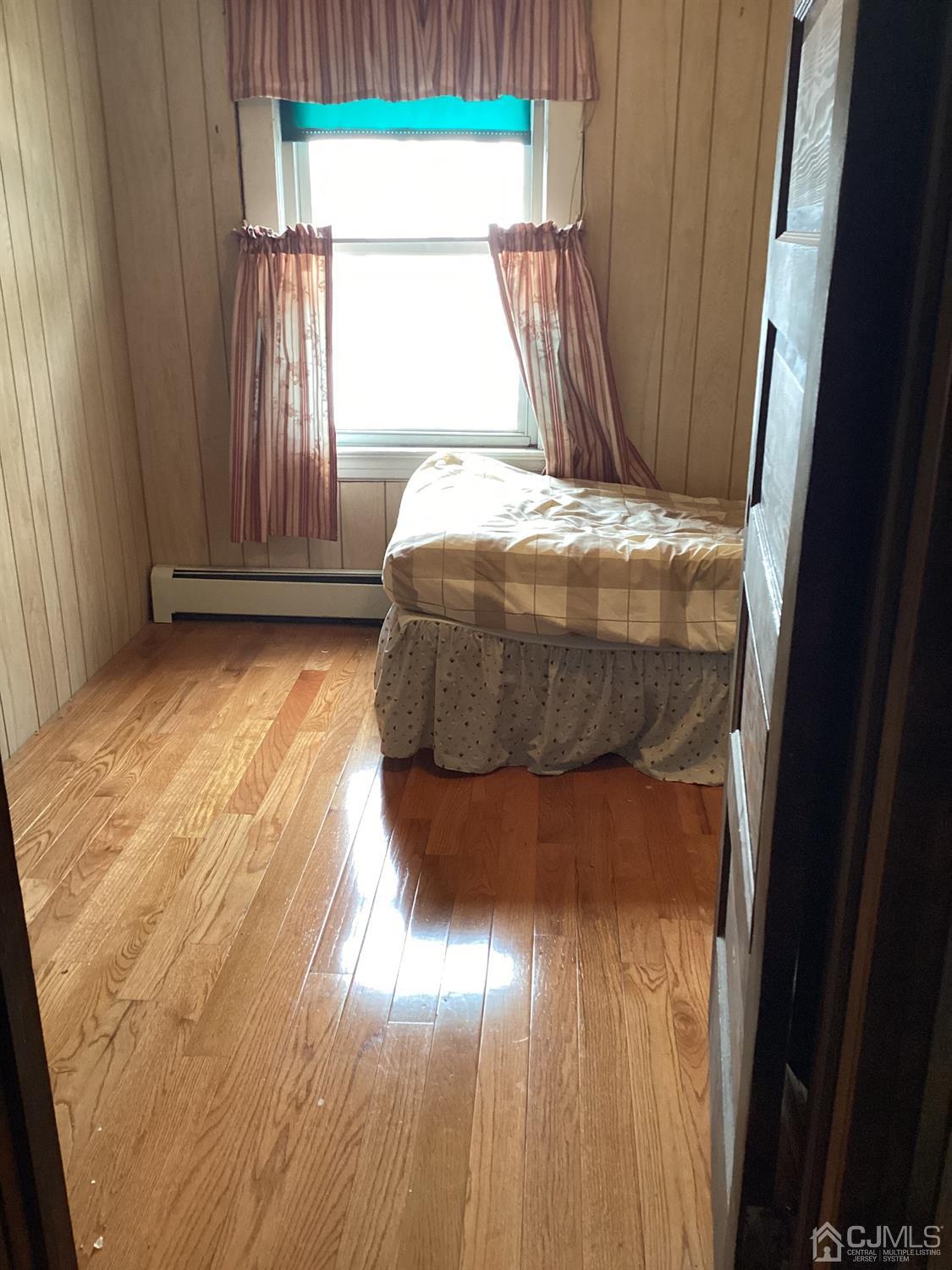 39 Silver Lake Avenue Edison, NJ 08817 - Photo 8 of 20 a bed sitting in a bedroom next to a window
