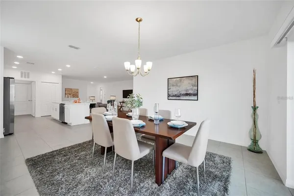 a dining room with furniture and window