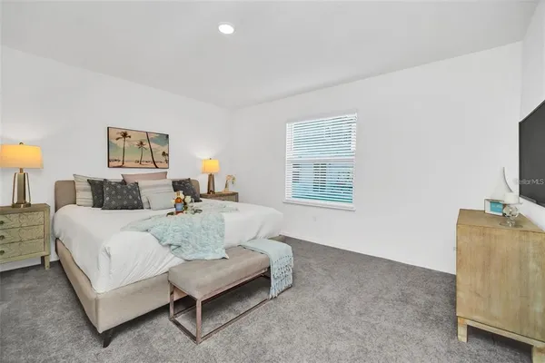 a bed room with a bed and a couch