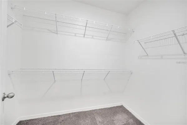 a view of a room with racks on the wall