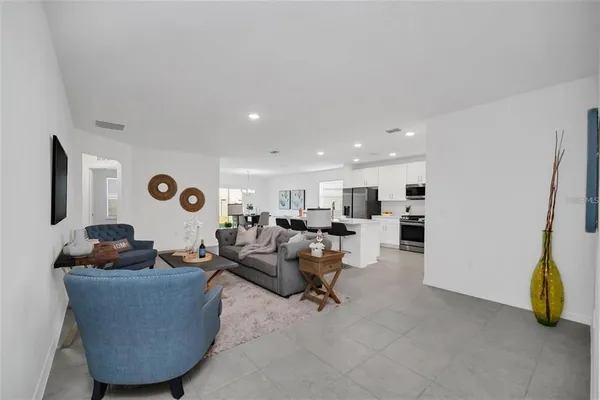 a living room with furniture and a table