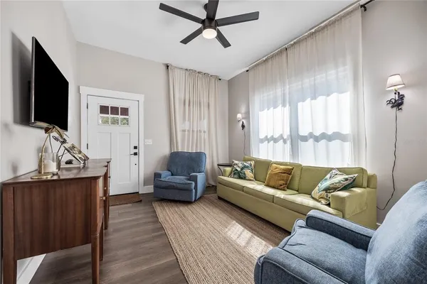 a living room with furniture and a flat screen tv