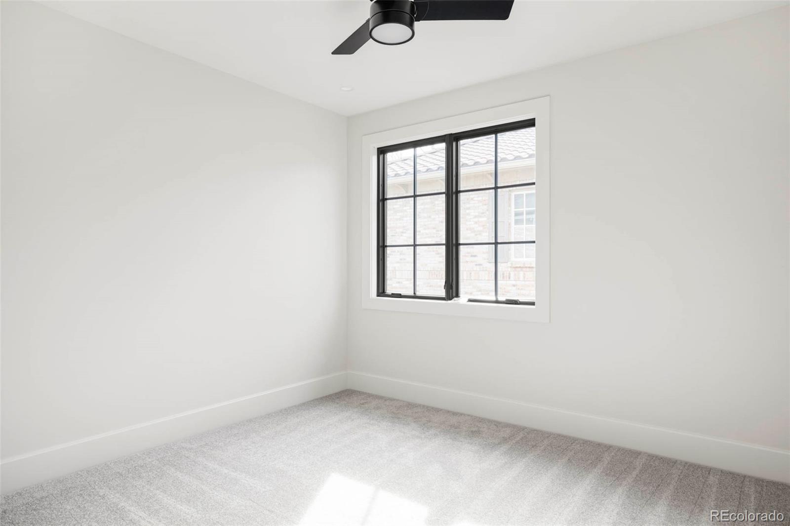 295 Kearney Street Denver, CO 80220 - Photo 20 of 41 an empty room with a window
