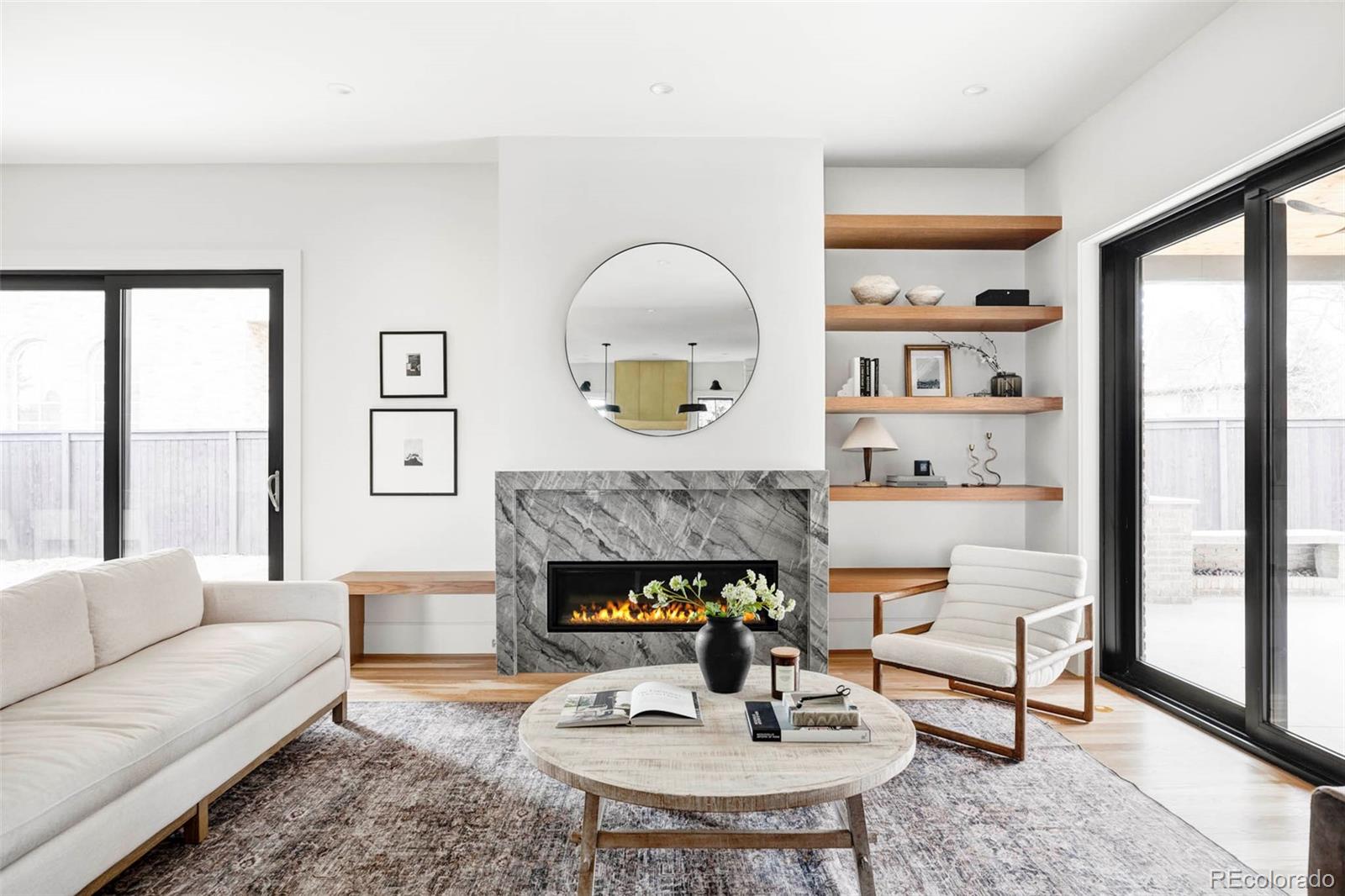 295 Kearney Street Denver, CO 80220 - Photo 2 of 39 a living room with furniture and a fireplace