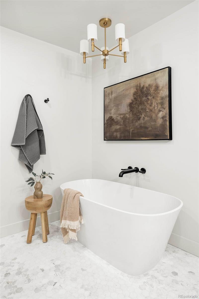 295 Kearney Street Denver, CO 80220 - Photo 22 of 39 a white bath tub sitting next to a white toilet