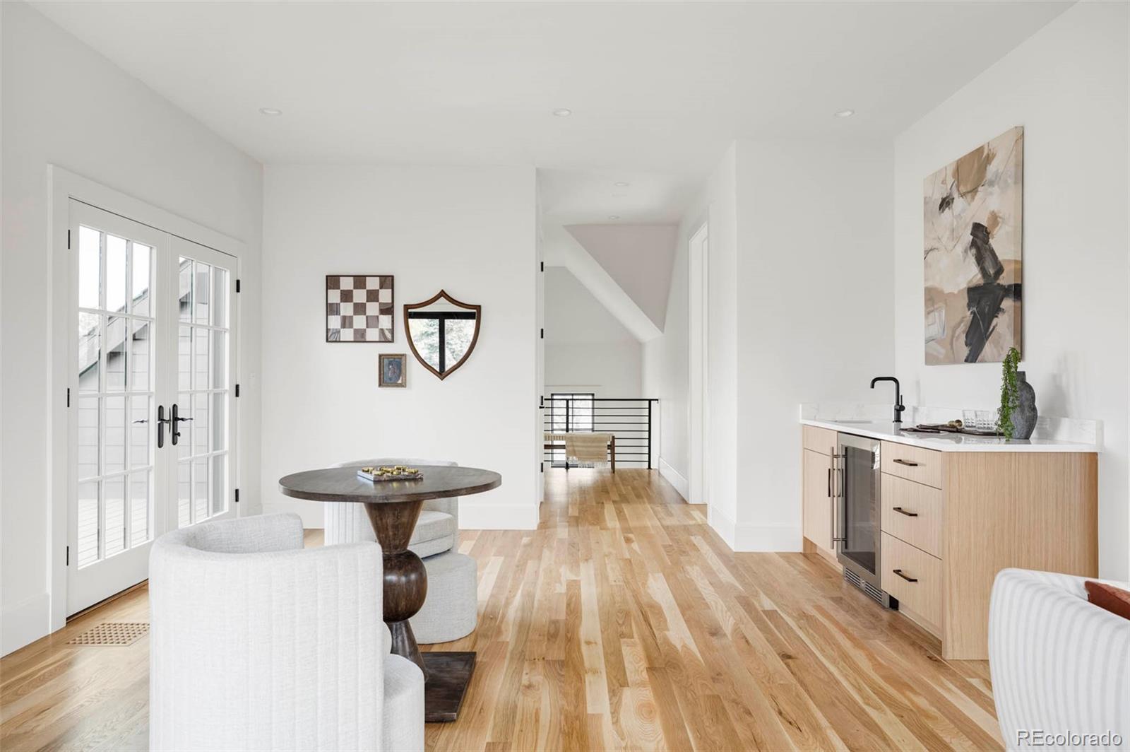 295 Kearney Street Denver, CO 80220 - Photo 23 of 41 a room with furniture and a wooden floor