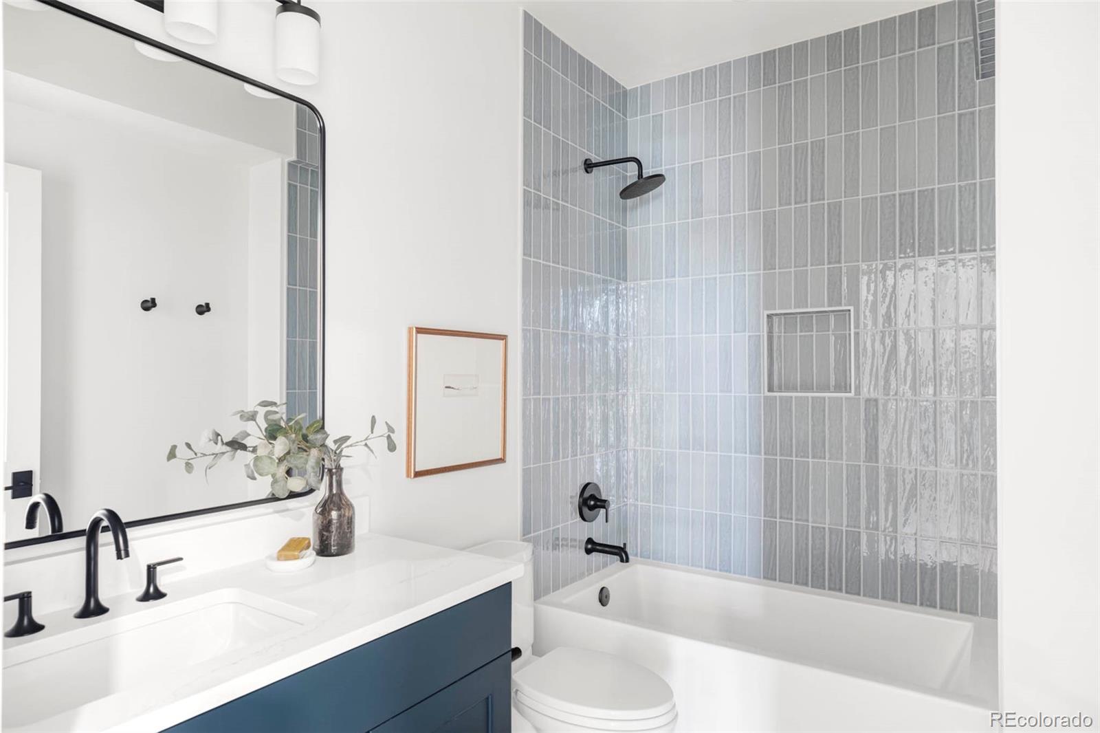 295 Kearney Street Denver, CO 80220 - Photo 26 of 39 a bathroom with a sink and a mirror
