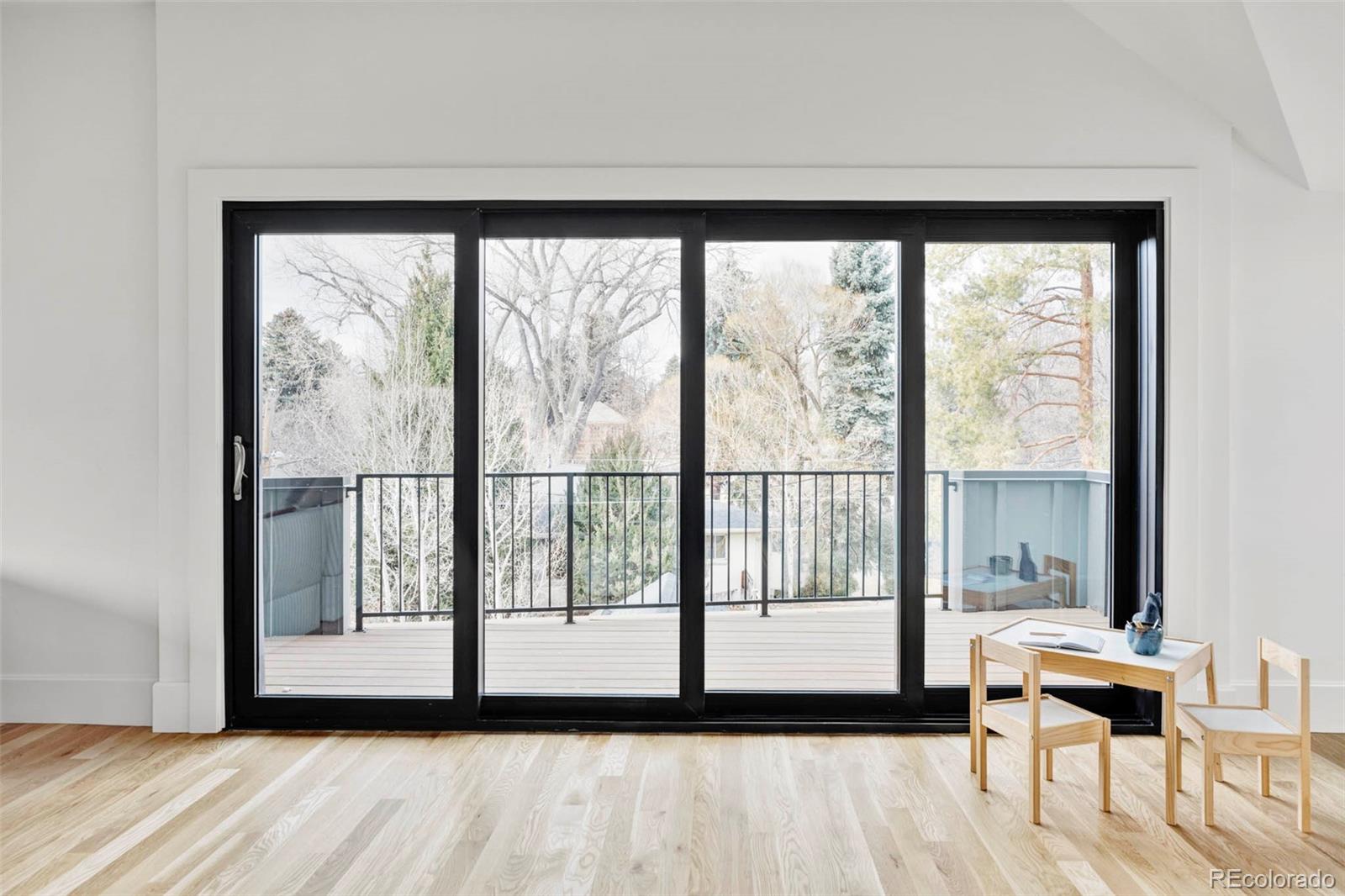 295 Kearney Street Denver, CO 80220 - Photo 27 of 41 a view of a large window with wooden floor