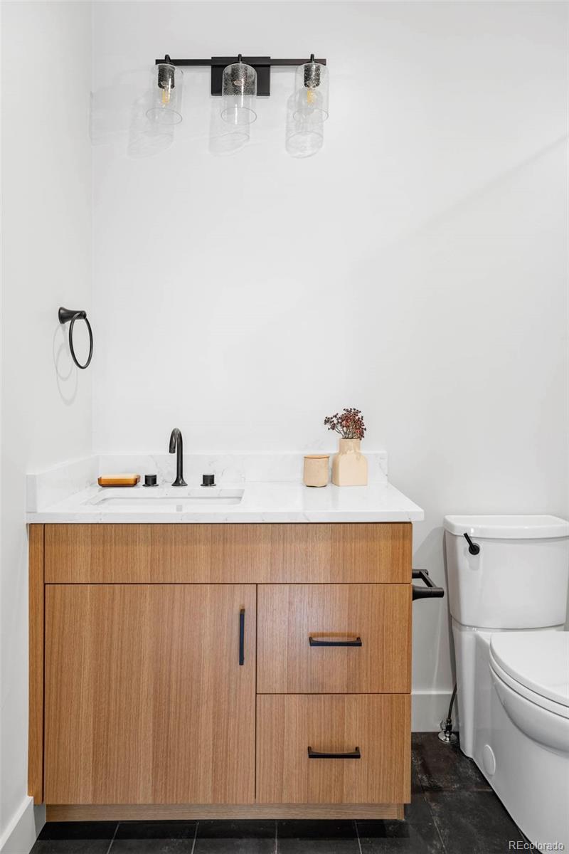 295 Kearney Street Denver, CO 80220 - Photo 29 of 41 a bathroom with a sink and toilet