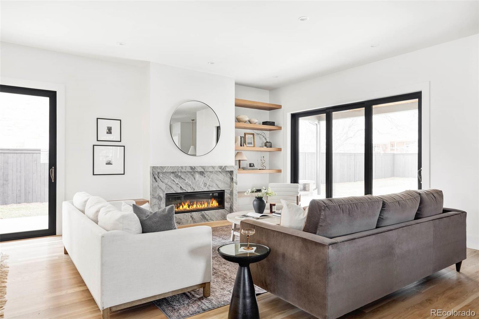 295 Kearney Street Denver, CO 80220 - Photo 3 of 39 a living room with furniture and a fireplace
