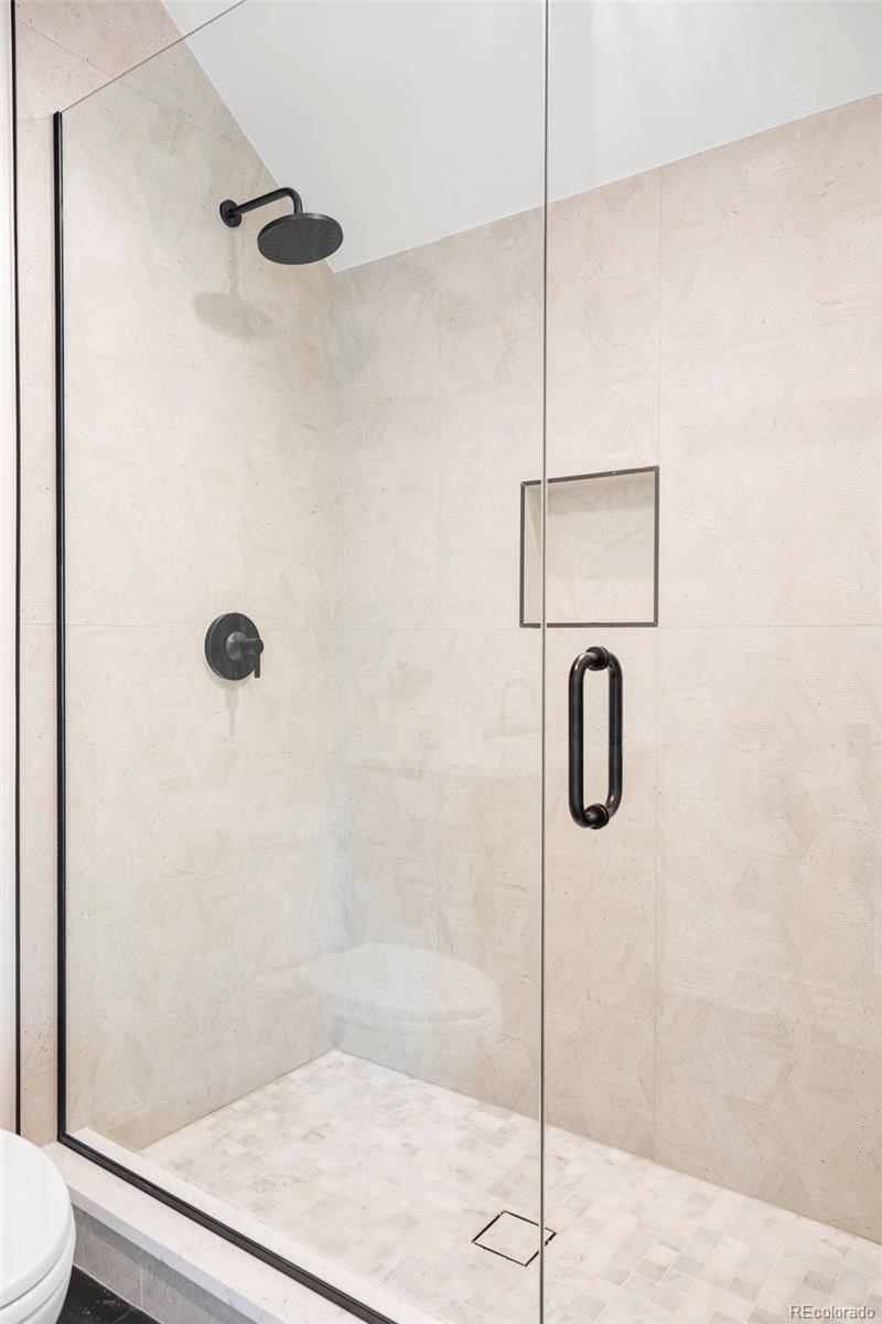 295 Kearney Street Denver, CO 80220 - Photo 31 of 39 a bathroom with a shower