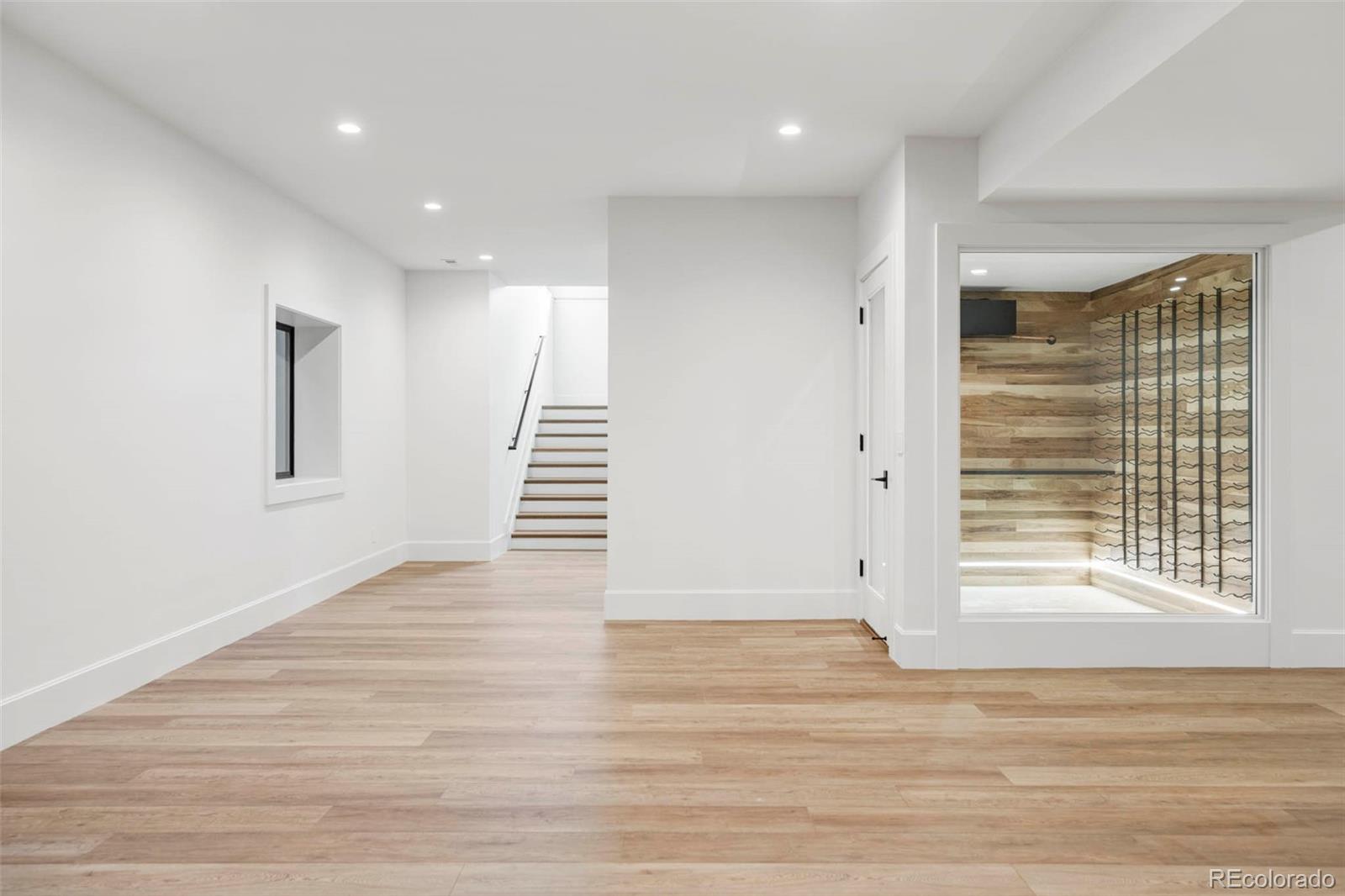295 Kearney Street Denver, CO 80220 - Photo 33 of 39 a view of an empty room with wooden floor and a window