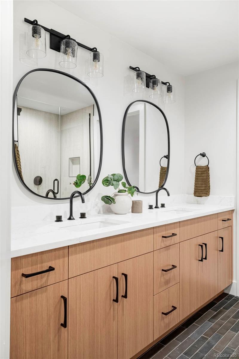 295 Kearney Street Denver, CO 80220 - Photo 37 of 39 a bathroom with a double vanity sink and a mirror