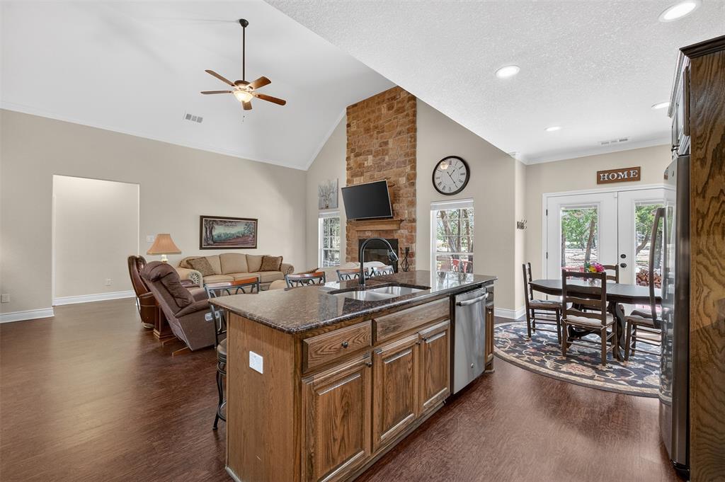 403 Arrowhead Point Kerens, TX 75144 - Photo 17 of 40 a kitchen with a stove and a table