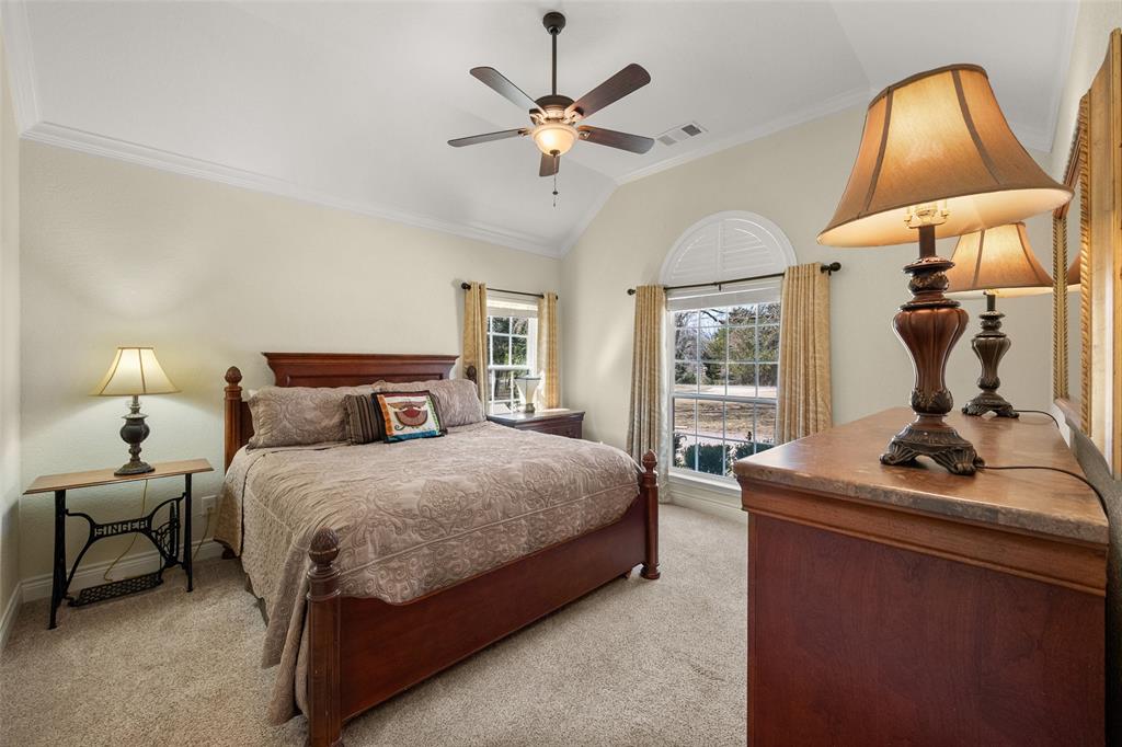 403 Arrowhead Point Kerens, TX 75144 - Photo 20 of 40 a bedroom with a bed and window