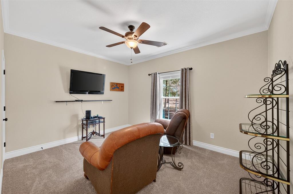 403 Arrowhead Point Kerens, TX 75144 - Photo 28 of 40 a living room with furniture and a flat screen tv