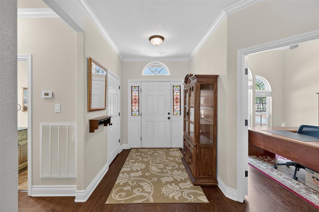 403 Arrowhead Point Kerens, TX 75144 - Photo 3 of 40 a view of a hallway with front door