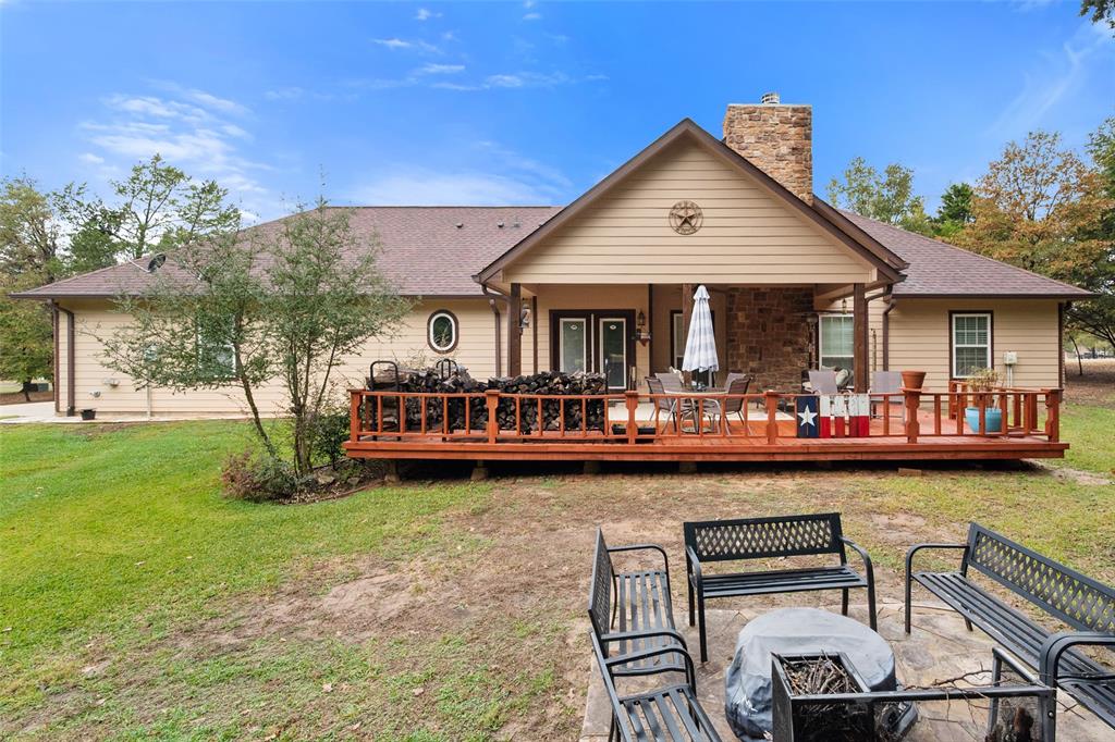 403 Arrowhead Point Kerens, TX 75144 - Photo 36 of 40 a view of a chairs and table in the patio next to a yard