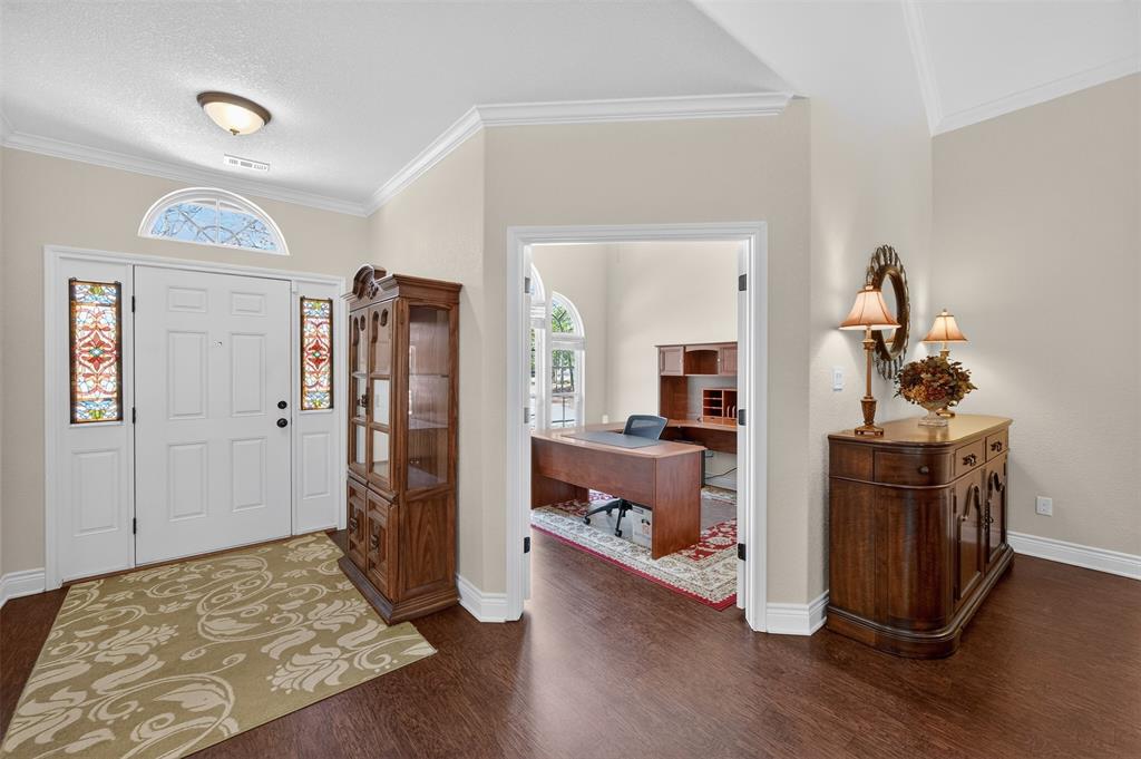 403 Arrowhead Point Kerens, TX 75144 - Photo 4 of 40 a bedroom with furniture and wooden floor