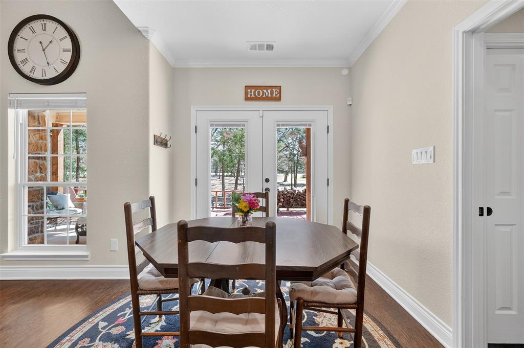 403 Arrowhead Point Kerens, TX 75144 - Photo 10 of 40 a view of a dining room with furniture window and wooden floor