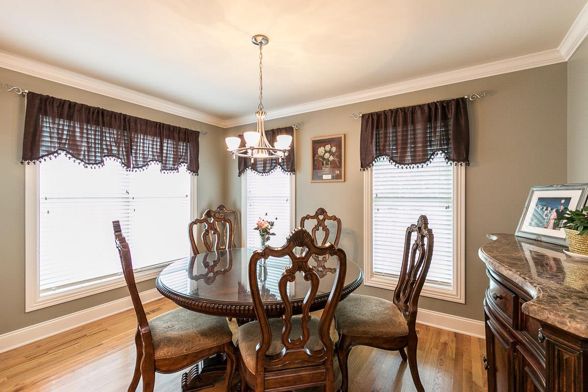 1232 Sugar Flat Road Lebanon, TN 37087 - Photo 11 of 30 a view of a dining room with furniture window and wooden floor