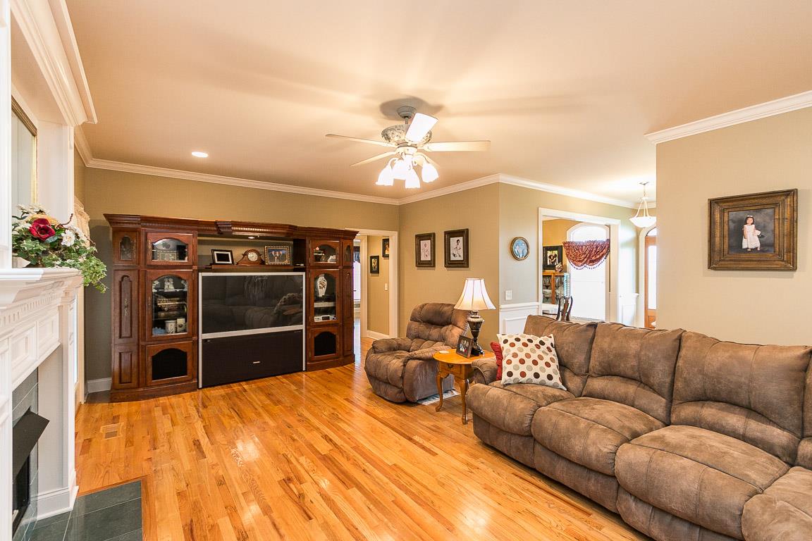 1232 Sugar Flat Road Lebanon, TN 37087 - Photo 16 of 30 a living room with furniture a flat screen tv and kitchen view