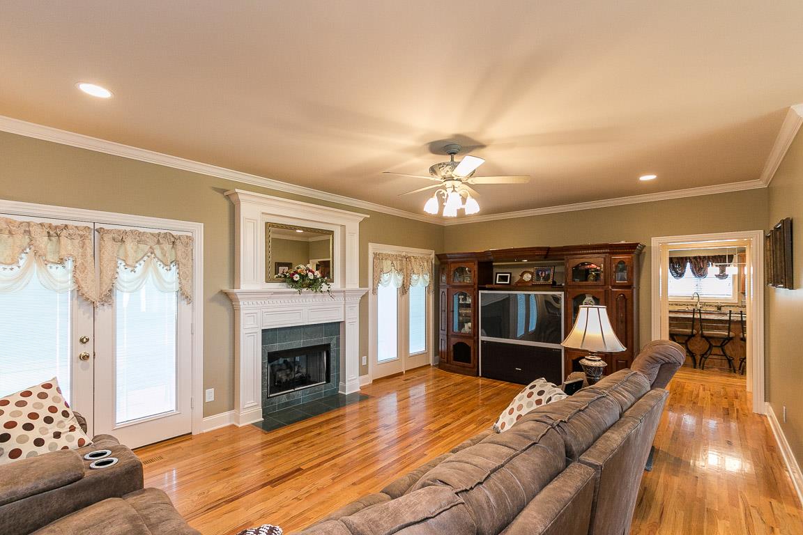 1232 Sugar Flat Road Lebanon, TN 37087 - Photo 17 of 30 a view of a livingroom with furniture and a fireplace