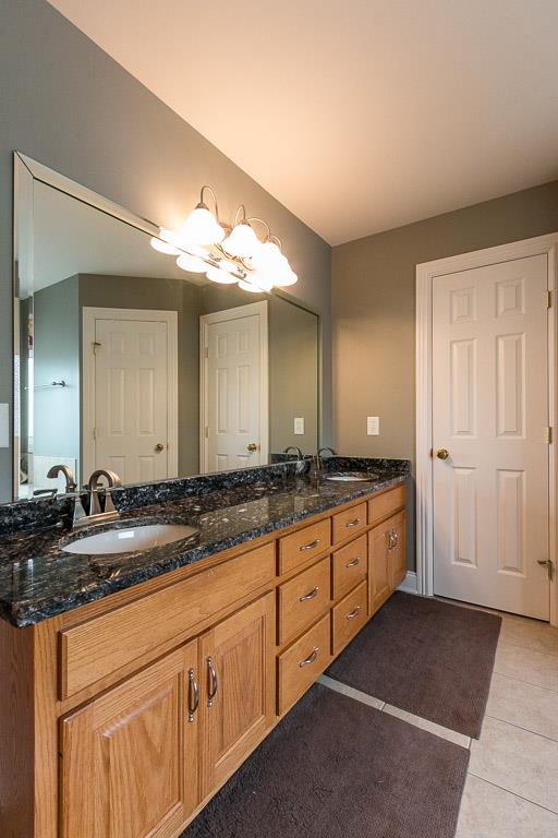 1232 Sugar Flat Road Lebanon, TN 37087 - Photo 21 of 30 a spacious bathroom with double sink and a mirror