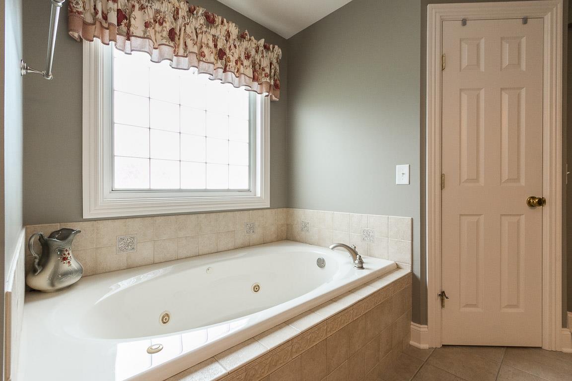 1232 Sugar Flat Road Lebanon, TN 37087 - Photo 23 of 30 a white bath tub sitting next to a window