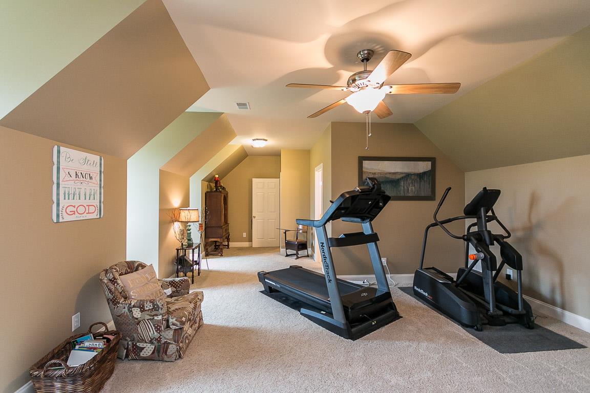 1232 Sugar Flat Road Lebanon, TN 37087 - Photo 27 of 30 a living room with furniture and a chandelier