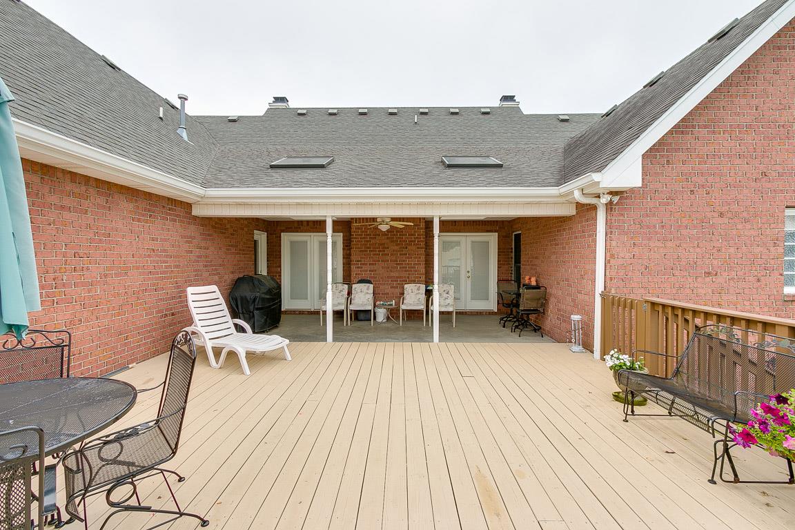 1232 Sugar Flat Road Lebanon, TN 37087 - Photo 3 of 30 a patio with table and chairs