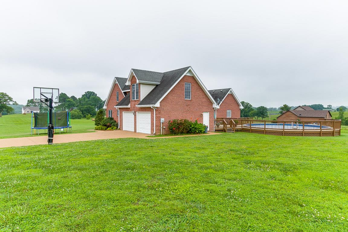 1232 Sugar Flat Road Lebanon, TN 37087 - Photo 6 of 30 a view of a house with a big yard and large trees