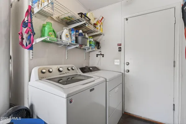 a utility room with dryer and washer