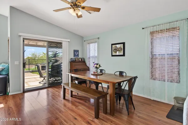 a view of a dining room with furniture window and wooden floor