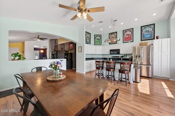 a view of a dining room with furniture and wooden floor