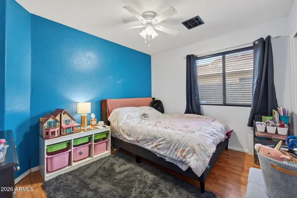 a bedroom with bed and a window