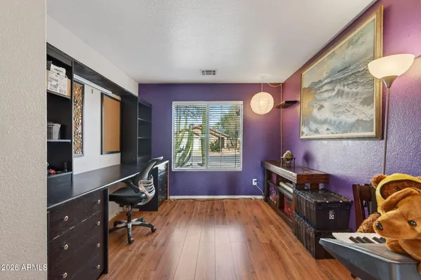 a room with furniture and wooden floor