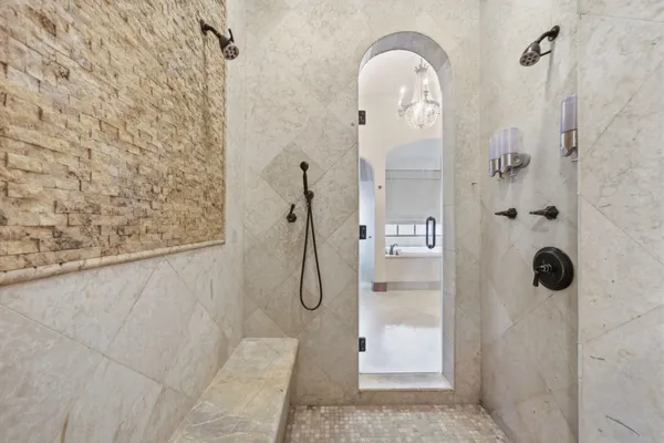 a spacious bathroom with a double vanity sink mirror and double