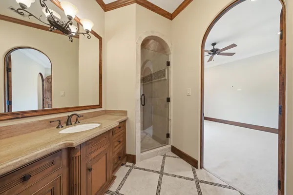 a view of a livingroom with a ceiling fan and window